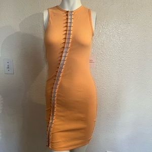 Mini orange dress design with safety-pin all down